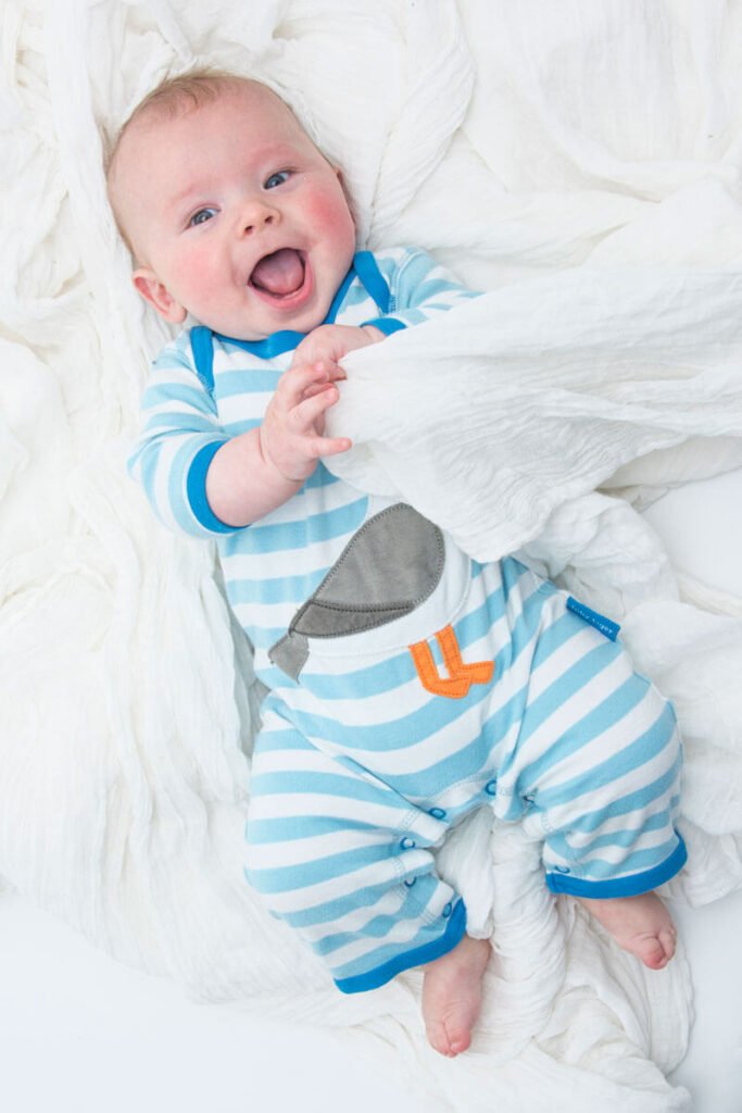 Baby laying on blanket by Nick Ford Photography