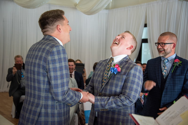 Wedding couple laughing during vows by Nick Ford Photography